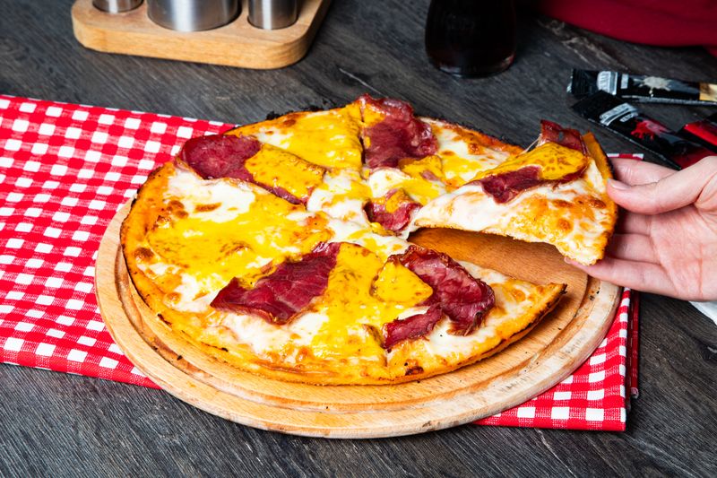 Meat lovers deep dish pizza for catering